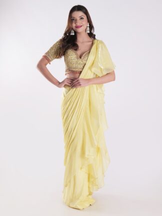 Vibrant Yellow Saree With A Ruffled Design And Golden Embellished Blouse With A Plunging Neckline