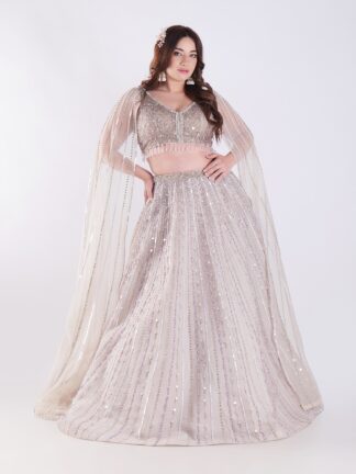 Light Colored Embrace Regal Elegance in This Champagne Sequin Embellished Lehenga Set