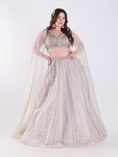 Light Colored Embrace Regal Elegance in This Champagne Sequin Embellished Lehenga Set