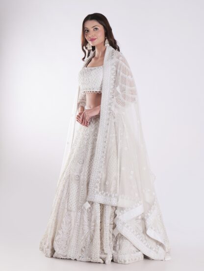 Heavily Embellished With Sequins And Pearls Creating A White Shimmering Effect Bridal Lehenga Choli