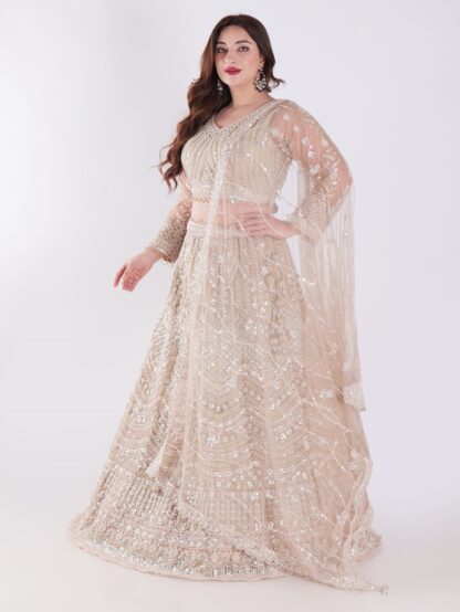 Intricately Designed Cream Colored Luxurious And Elegant Look Party Wear Lehenga Set