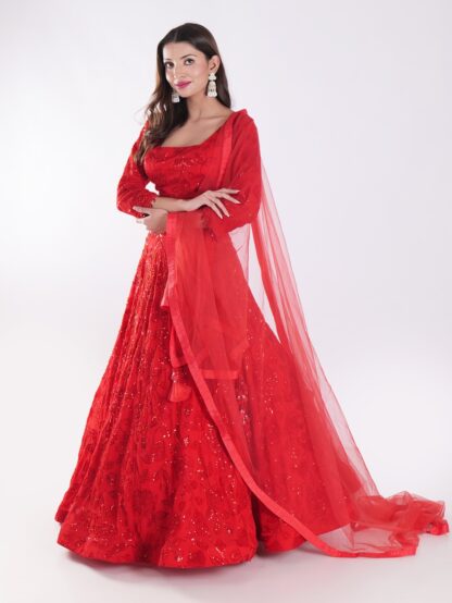 Backdrop Adorned In A Vibrant Red Party Wear Lehenga Choli Set