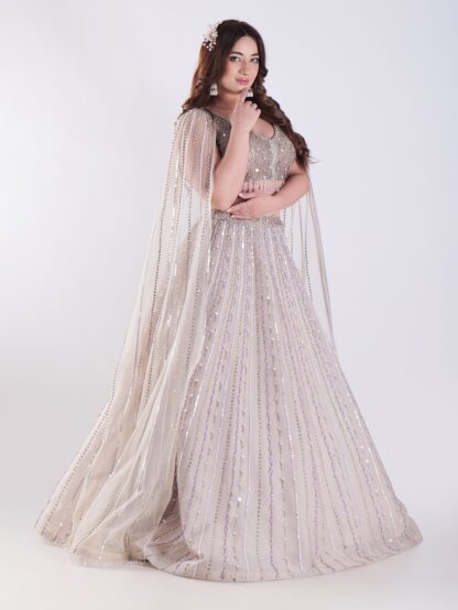 Light Colored Embrace Regal Elegance in This Champagne Sequin Embellished Lehenga Set