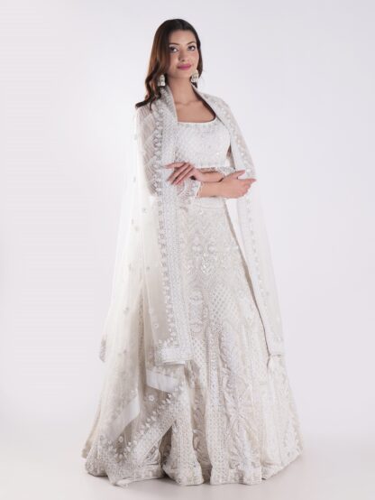 Heavily Embellished With Sequins And Pearls Creating A White Shimmering Effect Bridal Lehenga Choli