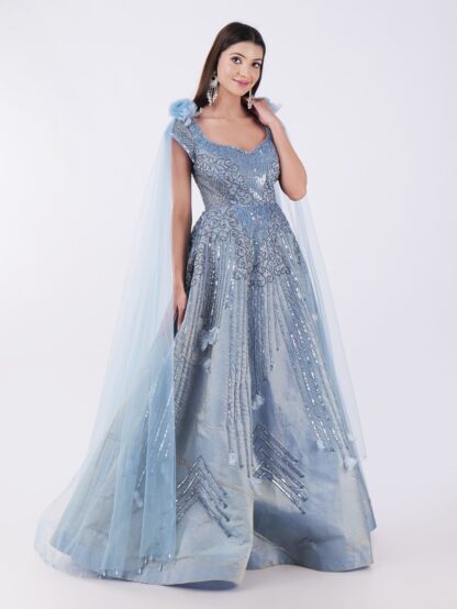 Radiate Royal Elegance In This Stunning Icy Blue Embroidered Gown with Cape Sleeves