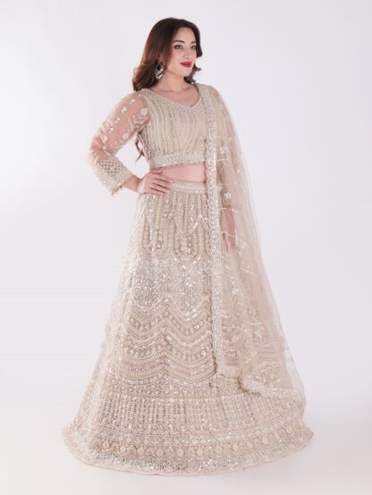 Intricately Designed Cream Colored Luxurious And Elegant Look Party Wear Lehenga Set