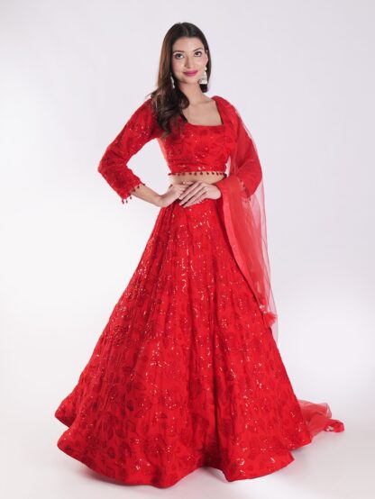 Backdrop Adorned In A Vibrant Red Party Wear Lehenga Choli Set