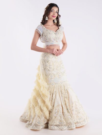 White And Cream Colored Heavily Embellished With A Sheer Dupatta Fish Cut Lehenga Set