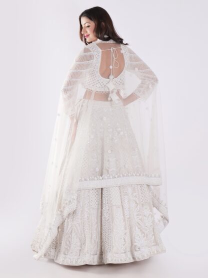 Heavily Embellished With Sequins And Pearls Creating A White Shimmering Effect Bridal Lehenga Choli