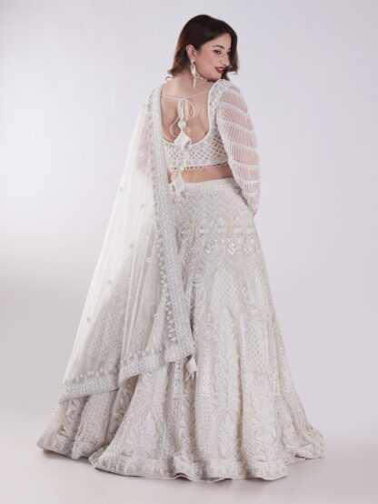 Delicate Floral Patterns And Sparkling Embellishments With Shimmering Effect Engagement Luxury Lehenga Set