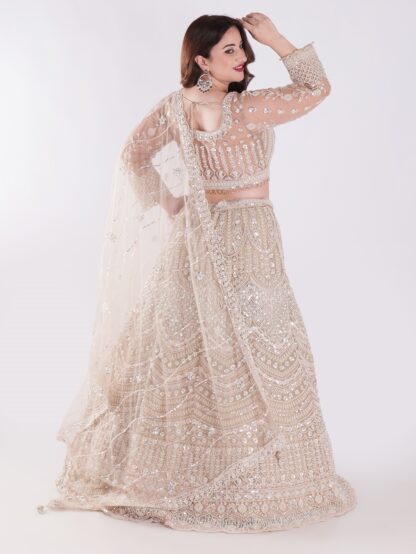 Intricately Designed Cream Colored Luxurious And Elegant Look Party Wear Lehenga Set