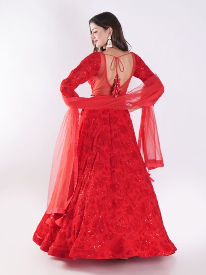 Backdrop Adorned In A Vibrant Red Party Wear Lehenga Choli Set