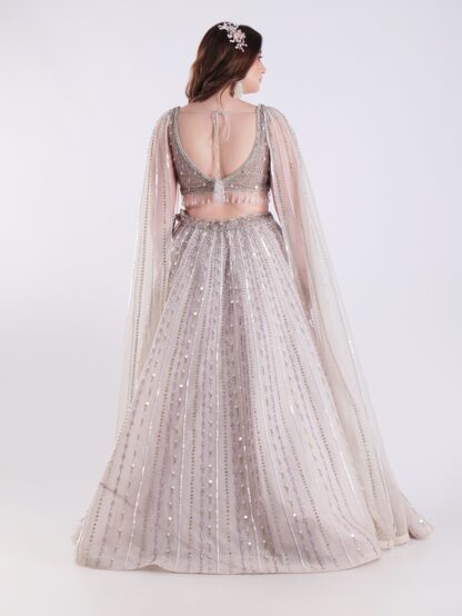 Light Colored Embrace Regal Elegance in This Champagne Sequin Embellished Lehenga Set