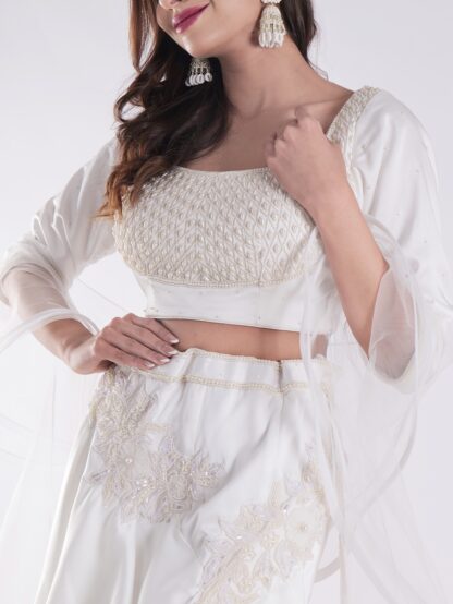 White Flowing Intricate Layers Of Ruffles Dramatic And Elegant Silhouette Cocktail Lehenga Set