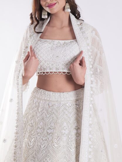 Heavily Embellished With Sequins And Pearls Creating A White Shimmering Effect Bridal Lehenga Choli