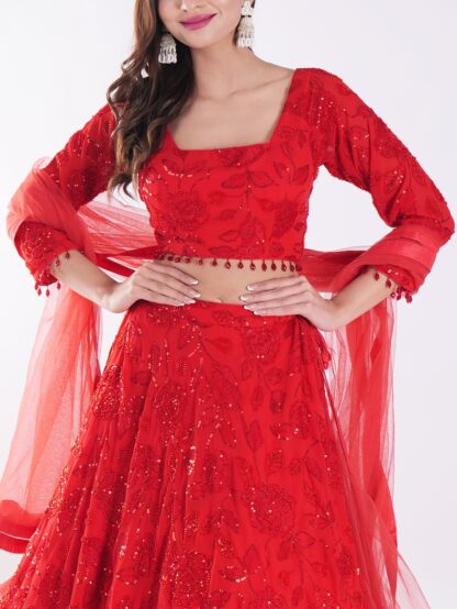 Backdrop Adorned In A Vibrant Red Party Wear Lehenga Choli Set