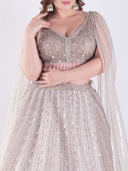 Light Colored Embrace Regal Elegance in This Champagne Sequin Embellished Lehenga Set
