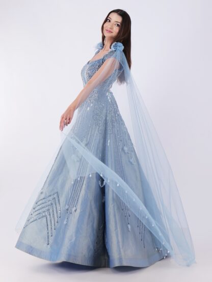 Radiate Royal Elegance In This Stunning Icy Blue Embroidered Gown with Cape Sleeves