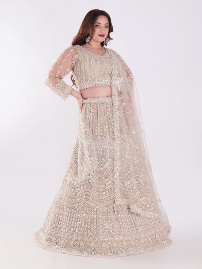 Intricately Designed Cream Colored Luxurious And Elegant Look Party Wear Lehenga Set