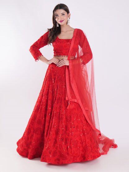Backdrop Adorned In A Vibrant Red Party Wear Lehenga Choli Set