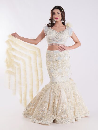 White And Cream Colored Heavily Embellished With A Sheer Dupatta Fish Cut Lehenga Set